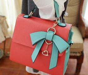 UNIQUE COMMUTER BOW HANDBAG